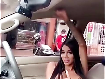 she is a very horny tgirl wanking it in the car and b